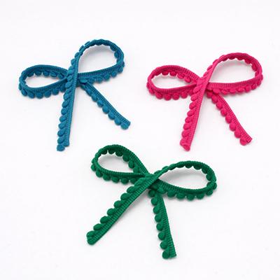 X-Bordura con pompon & pompon